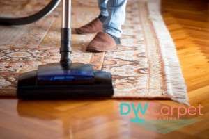 vacuuming-rug-with-fringes-rug-cleaning-dw-carpet-cleaning-singapore