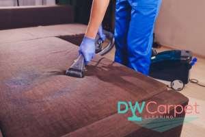 worker-vaccuming-fabric-sofa-cleaning-dw-carpet-cleaning-singapore